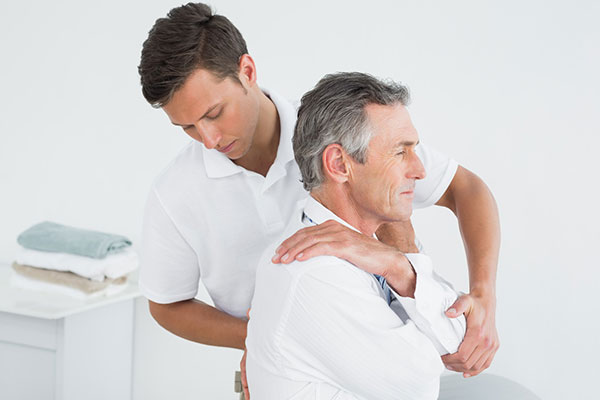 osteopath treating back pain