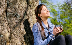 picture of young woman outdoors enjoying the sunshine vitamin d
